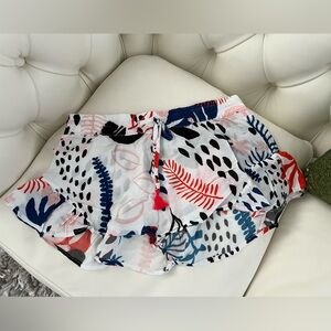 White and Red Athletic Shorts with Vibrant Print